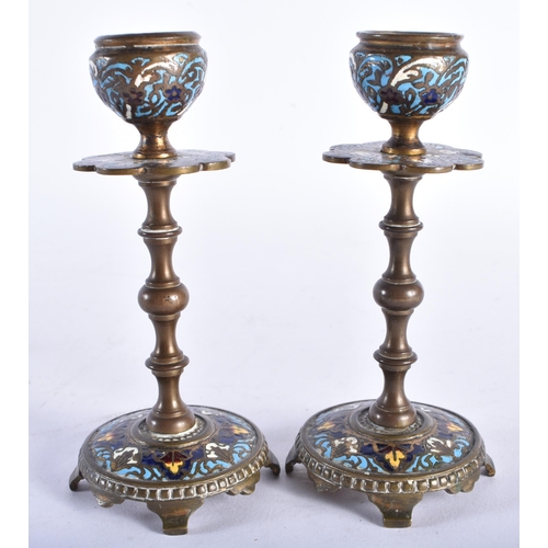 706 - A PAIR OF 19TH CENTURY FRENCH BRONZE CHAMPLEVE ENAMEL CANDLESTICKS. 13.5 cm high.