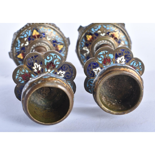 706 - A PAIR OF 19TH CENTURY FRENCH BRONZE CHAMPLEVE ENAMEL CANDLESTICKS. 13.5 cm high.