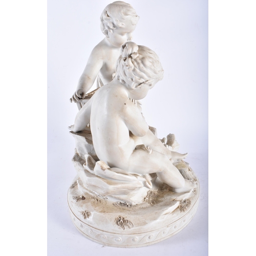 709 - AN ANTIQUE FRENCH PARIAN WARE PORCELAIN FIGURAL GROUP modelled as a boy and girl beside a bird cage.... 