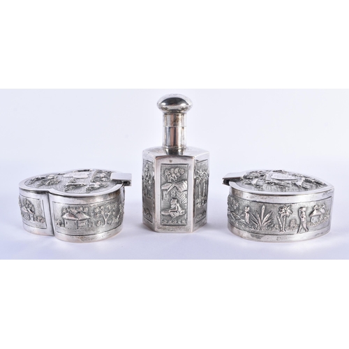 713 - A FINE 19TH CENTURY INDIAN SILVER DRESSING TABLE SET decorated in relief with figures within landsca... 