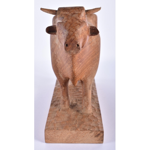 715 - AN ENGLISH CARVED WOOD FIGURE OF A BULL possibly from one of the Yorkshire Critters workshop. 24 cm ... 