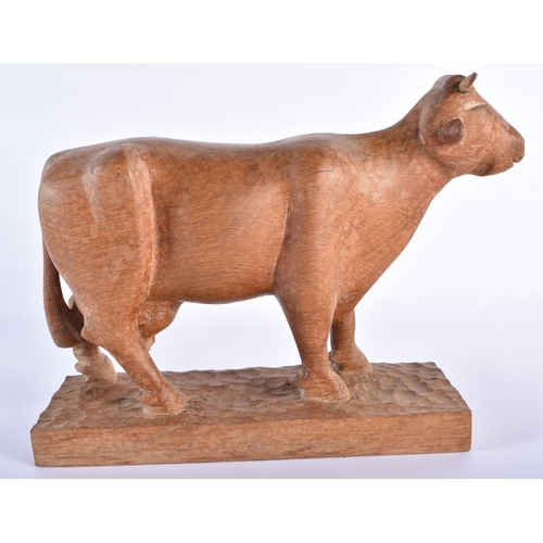 715 - AN ENGLISH CARVED WOOD FIGURE OF A BULL possibly from one of the Yorkshire Critters workshop. 24 cm ... 