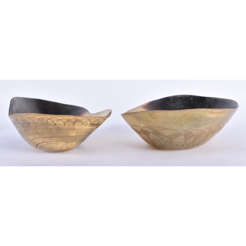 716 - A PAIR OF ANTIQUE TRIBAL CARVED BUFFALO HORN DRINKING CUPS possibly North American. 16 cm wide.