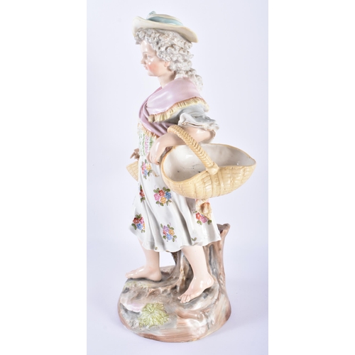 722 - A LARGE 19TH CENTURY GERMAN PORCELAIN FIGURE OF A FEMALE modelled holding two baskets. 33 cm high.