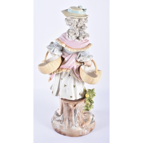 722 - A LARGE 19TH CENTURY GERMAN PORCELAIN FIGURE OF A FEMALE modelled holding two baskets. 33 cm high.