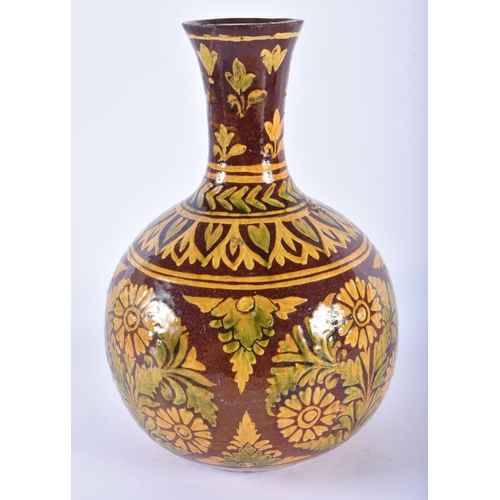 724 - AN ANTIQUE PERSIAN SLIP DECORATED ENAMELLED POTTERY VESSEL. 27 cm high.