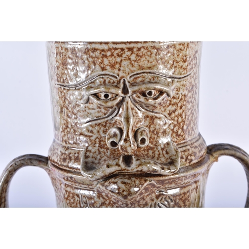 748 - A CHARMING LARGE STUDIO POTTERY SALT GLAZED CYLINDRICAL JAR AND COVER formed with a mask head. 49 cm... 