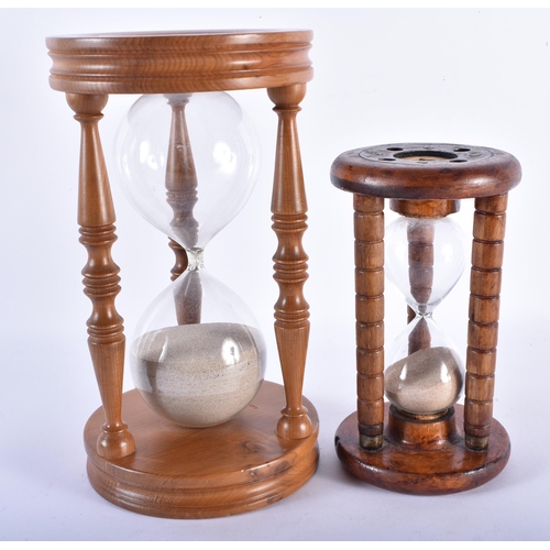 750 - TWO VINTAGE ENGLISH CARVED WOOD SAND TIMERS. Largest 24.5 cm high. (2)