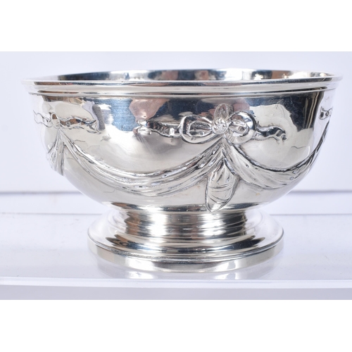 818 - A Victorian Silver Bowl with Ribbon Decoration.  Hallmarked London 1850.  6.6cm x 11.6cm, weight 148... 