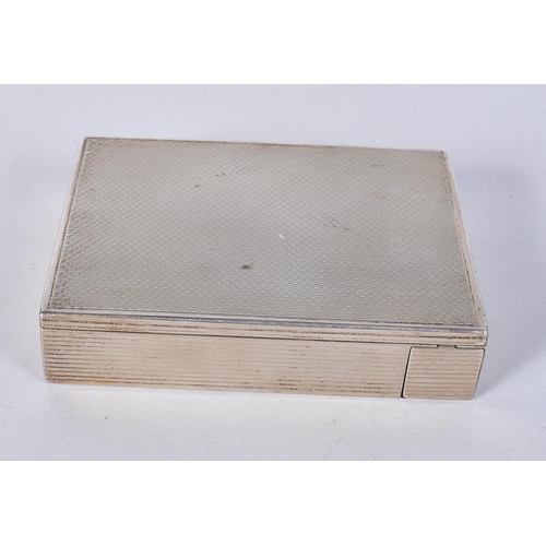 821 - A Continental Silver Engine Turned Combined Compact and Lipstick.  Stamped 800.  8.6cm x 6.2cm x 2cm... 