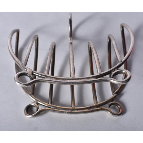 842 - A Victorian Silver Cradle Form Toast Rack by Hukin & Heath.  Hallmarked Birmingham 1899.  9.7cm x 10... 