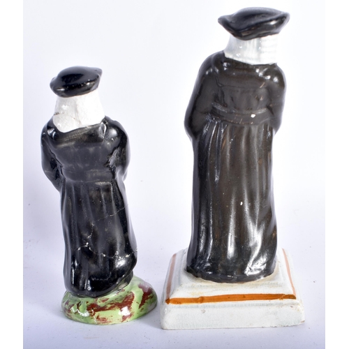 853 - TWO EARLY 19TH CENTURY STAFFORDSHIRE FIGURES both modelled as males in black robes. Larges 12.5 cm h... 