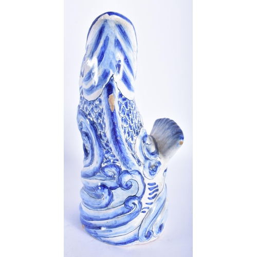 860 - AN ANTIQUE DELFT BLUE AND WHITE TIN GLAZED LEAPING FISH VASE. 21 cm high.