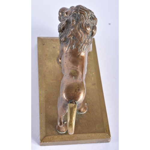 863 - A SMALL ANTIQUE BRONZE GRAND TOUR FIGURE OF A LION. 11 cm wide.