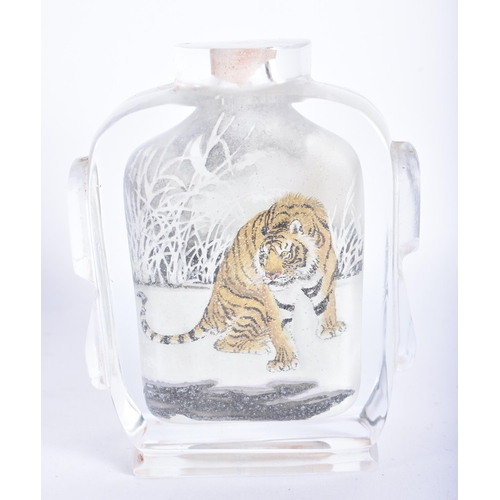 864 - A CHINESE REPUBLICAN PERIOD REVERSE PAINTED TIGER SNUFF BOTTLE. 9 cm high.