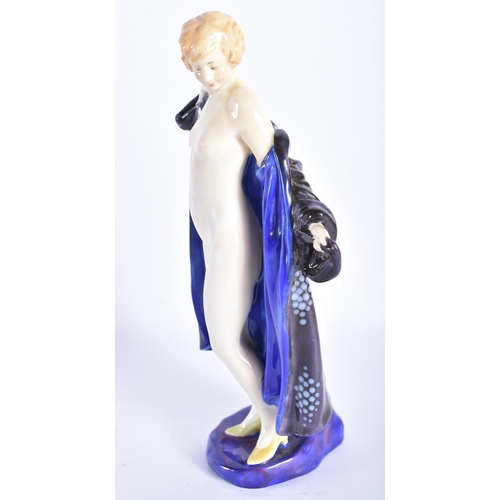 873 - A ROYAL DOULTON FIGURE OF THE BATHER HN 687. 19 cm high.