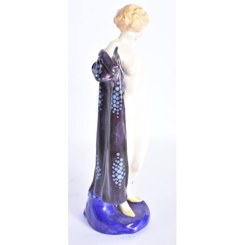 873 - A ROYAL DOULTON FIGURE OF THE BATHER HN 687. 19 cm high.