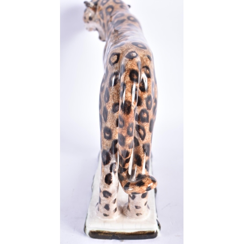 875 - AN UNUSUAL ART DECO AUSTRIAN KERAMIS FIGURE OF A CHEETAH. 20 cm wide.