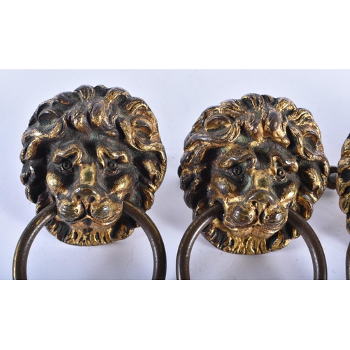 880 - A FINE SET OF FOUR GEORGE III GILT BRONZE LION MASK HEADS. 6.5 cm wide. (4)