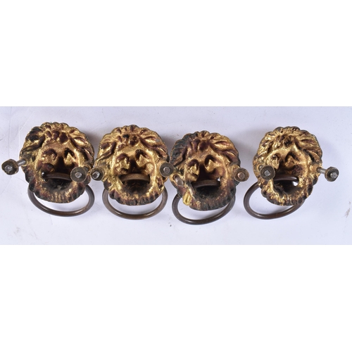 880 - A FINE SET OF FOUR GEORGE III GILT BRONZE LION MASK HEADS. 6.5 cm wide. (4)