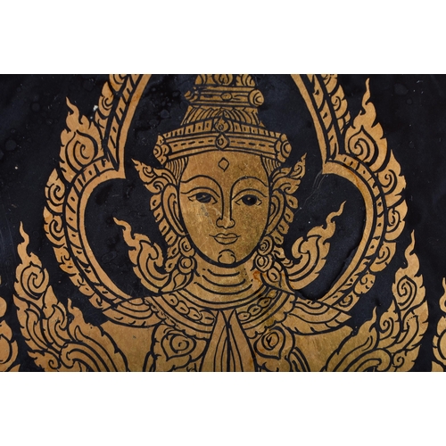 881 - A LARGE THAI PAINTED GILT PAINTED WOODEN PANEL. 30 cm diameter.