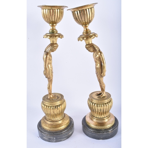 883 - A LOVELY PAIR OF 19TH CENTURY FRENCH ORMOLU STANDING  PHAROAH CANDLESTICKS. 24.5 cm high.