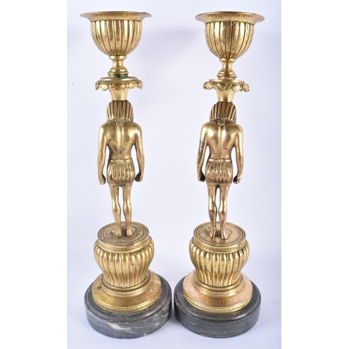 883 - A LOVELY PAIR OF 19TH CENTURY FRENCH ORMOLU STANDING  PHAROAH CANDLESTICKS. 24.5 cm high.