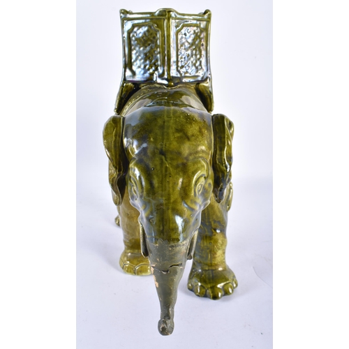 885 - A LARGE 19TH CENTURY CONTINENTAL MAJOLICA POTTERY GREEN GLAZED ELEPHANT VASE. 34 cm x 28 cm.