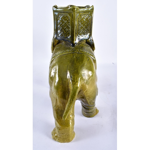 885 - A LARGE 19TH CENTURY CONTINENTAL MAJOLICA POTTERY GREEN GLAZED ELEPHANT VASE. 34 cm x 28 cm.