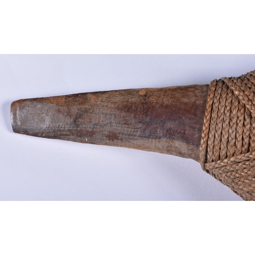 898 - A LOVELY TRIBAL CARVED WOOD ROPE BOUND AXE. 65 cm long.