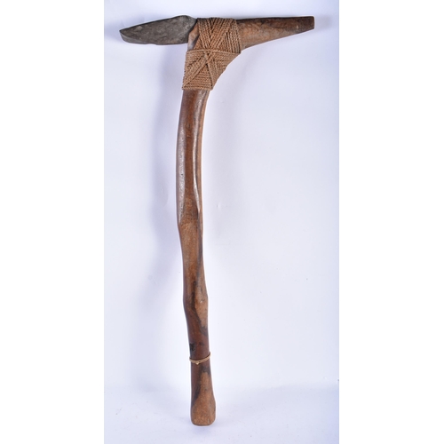 898 - A LOVELY TRIBAL CARVED WOOD ROPE BOUND AXE. 65 cm long.