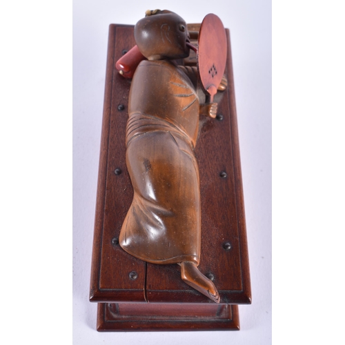 908 - A LOVELY EARLY 20TH CENTURY JAPANESE MEIJI PERIOD KOBE TOY modelled as a recumbent figure holding a ... 