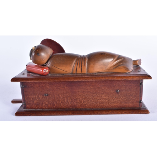 908 - A LOVELY EARLY 20TH CENTURY JAPANESE MEIJI PERIOD KOBE TOY modelled as a recumbent figure holding a ... 