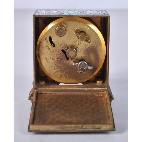 912 - A SMALL ANTIQUE CHAMPLEVE ENAMEL TRAVELLING CLOCK. 6 cm x 5 cm.