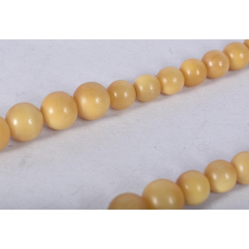 920 - A LATE 19TH CENTURY CHINESE CARVED BLONDE RHINOCEROS HORN NECKLACE. 44 grams. 42 cm long, largest be... 