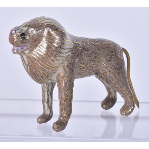 923 - A CHINESE CLOISONNE ENAMEL LION. 10 cm x 5 cm.