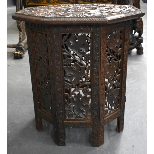 993 - TWO 19TH CENTURY MIDDLE EASTERN LIBERTY STYLE CARVED WOOD TABLES. Largest 50 cm high. (2)