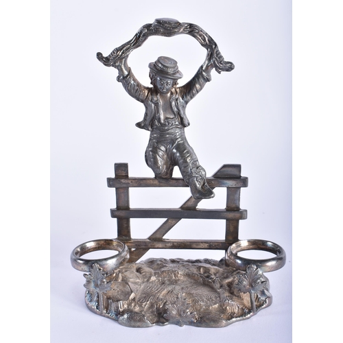 10 - A PAIR OF ANTIQUE SPELTER FIGURES together with a silver plated figural cruet stand. Largest 29 cm h... 