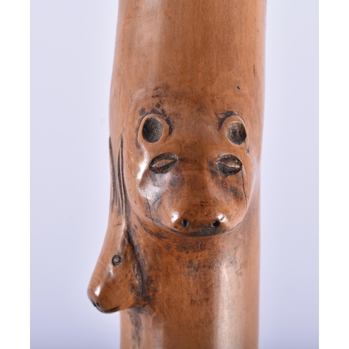 116 - AN 18TH/19TH CENTURY CONTINENTAL CARVED FOLK ART WOOD WALKING CANE formed with bears, cow, deer and ... 