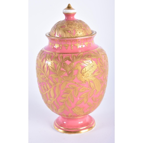 12 - A SMALL ANTIQUE DERBY PINK GROUND PORCELAIN VASE AND COVER painted in raised gilt with foliage. 13.5... 