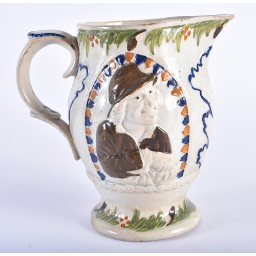 14 - AN EARLY 19TH CENTURY ENGLISH PRATTWARE JUG decorated with portraits. 14 cm high.