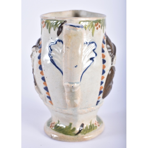 14 - AN EARLY 19TH CENTURY ENGLISH PRATTWARE JUG decorated with portraits. 14 cm high.