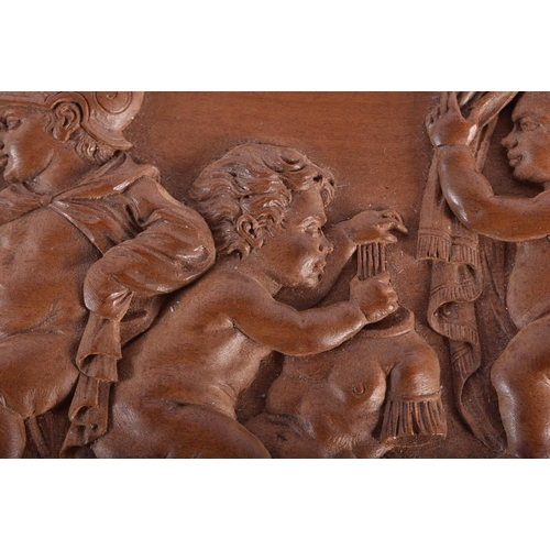 15 - A 19TH CENTURY EUROPEAN CARVED WOOD TREEN PANEL OF FIGURES modelled in various pursuits. 15.5 cm x 1... 