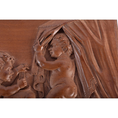 15 - A 19TH CENTURY EUROPEAN CARVED WOOD TREEN PANEL OF FIGURES modelled in various pursuits. 15.5 cm x 1... 