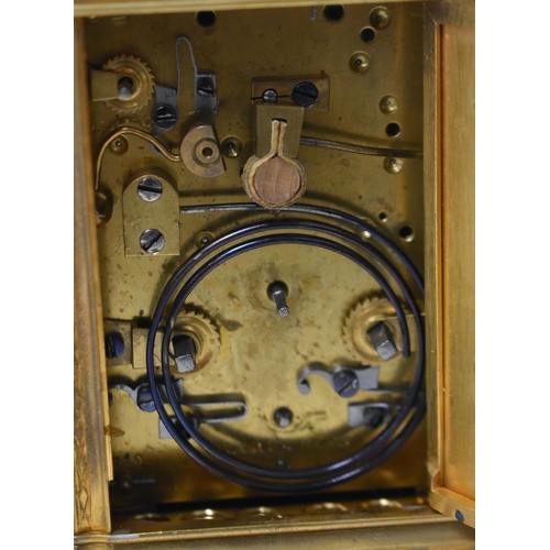 24 - A FINE 19TH CENTURY FRENCH GILT BRASS REPEATING CARRIAGE CLOCK beautifully engraved with foliage and... 