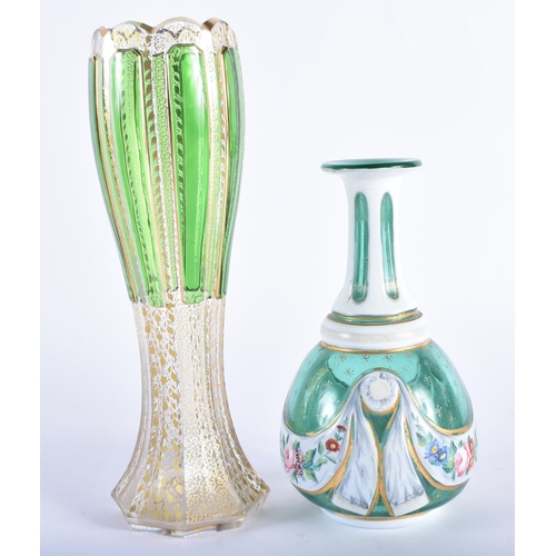 25 - AN ANTIQUE BOHEMIAN GLASS VASE together with a similar bottle. Largest 20 cm high. (2)