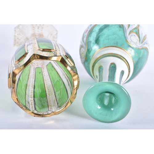 25 - AN ANTIQUE BOHEMIAN GLASS VASE together with a similar bottle. Largest 20 cm high. (2)