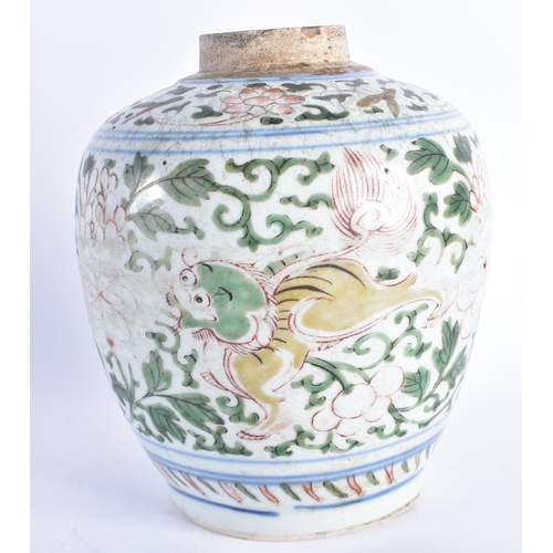 254 - A 17TH CENTURY CHINESE WUCAI PORCELAIN TRANSITIONAL JAR Shunzhi, painted with playful Buddhistic lio... 