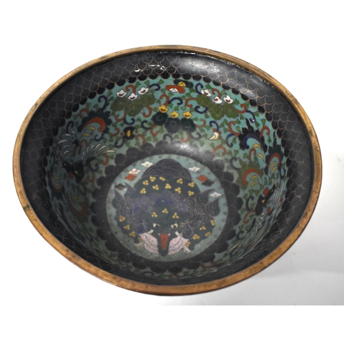 255 - A CHINESE QING DYNASTY CLOISONNE ENAMEL BOWL decorated internally with a Buddhistic lion amongst fol... 