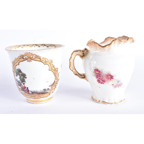 256 - AN 18TH CENTURY MEISSEN PORCELAIN FLARED TEABOWL together with a later jug. Largest 7.25 cm high. (2... 